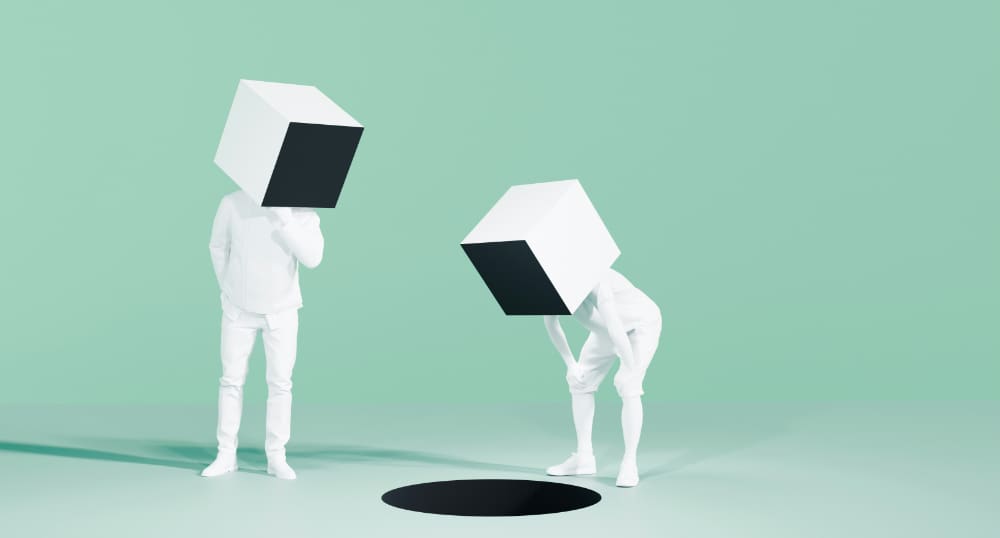 Cartoon-style image of two humans with block-shaped helmets in white suits pondering black circle on the ground.