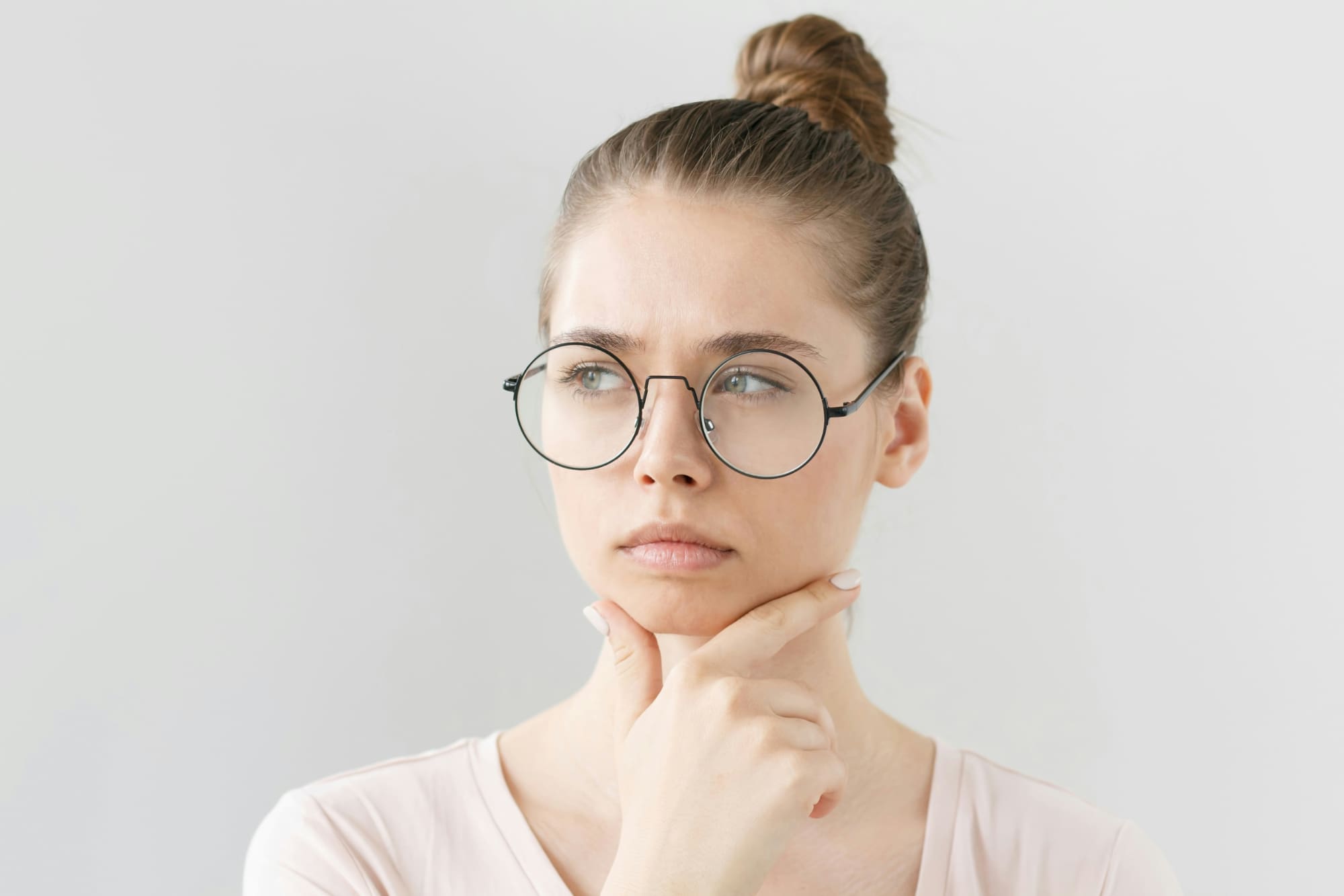 Close up of contemplative office worker's face.