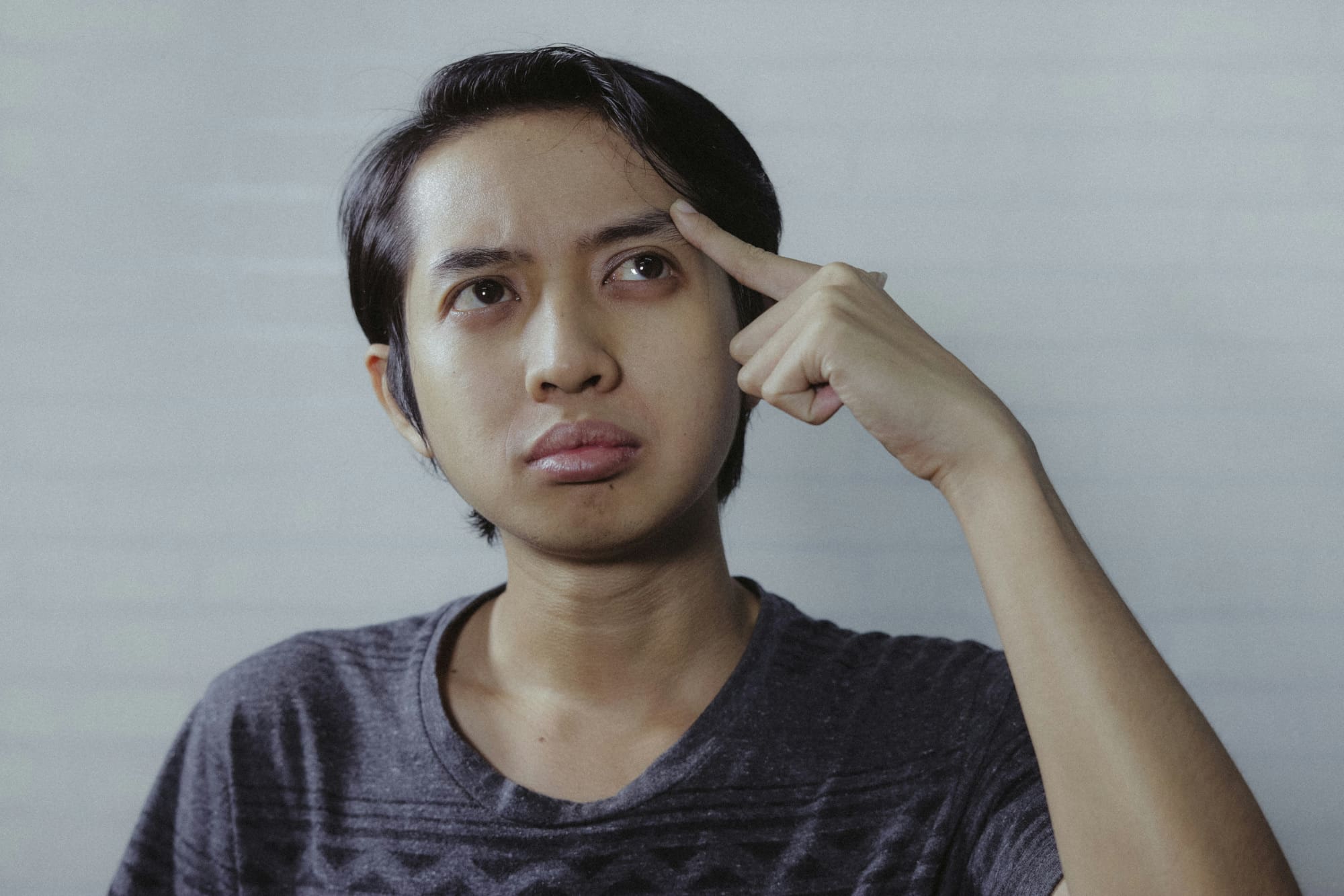 Close up of office worker making confused face.